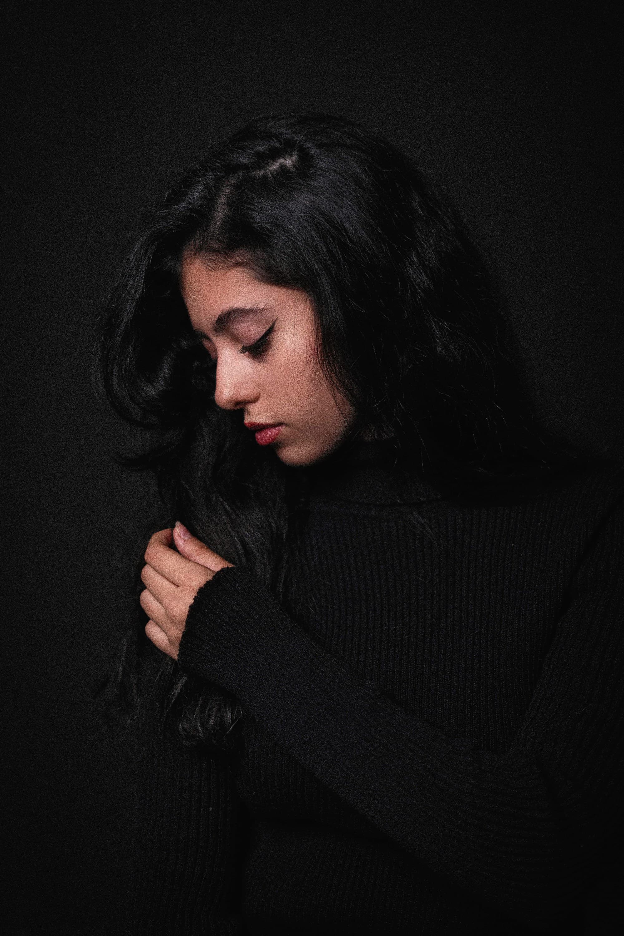 Editorial studio portrait, long dark hair