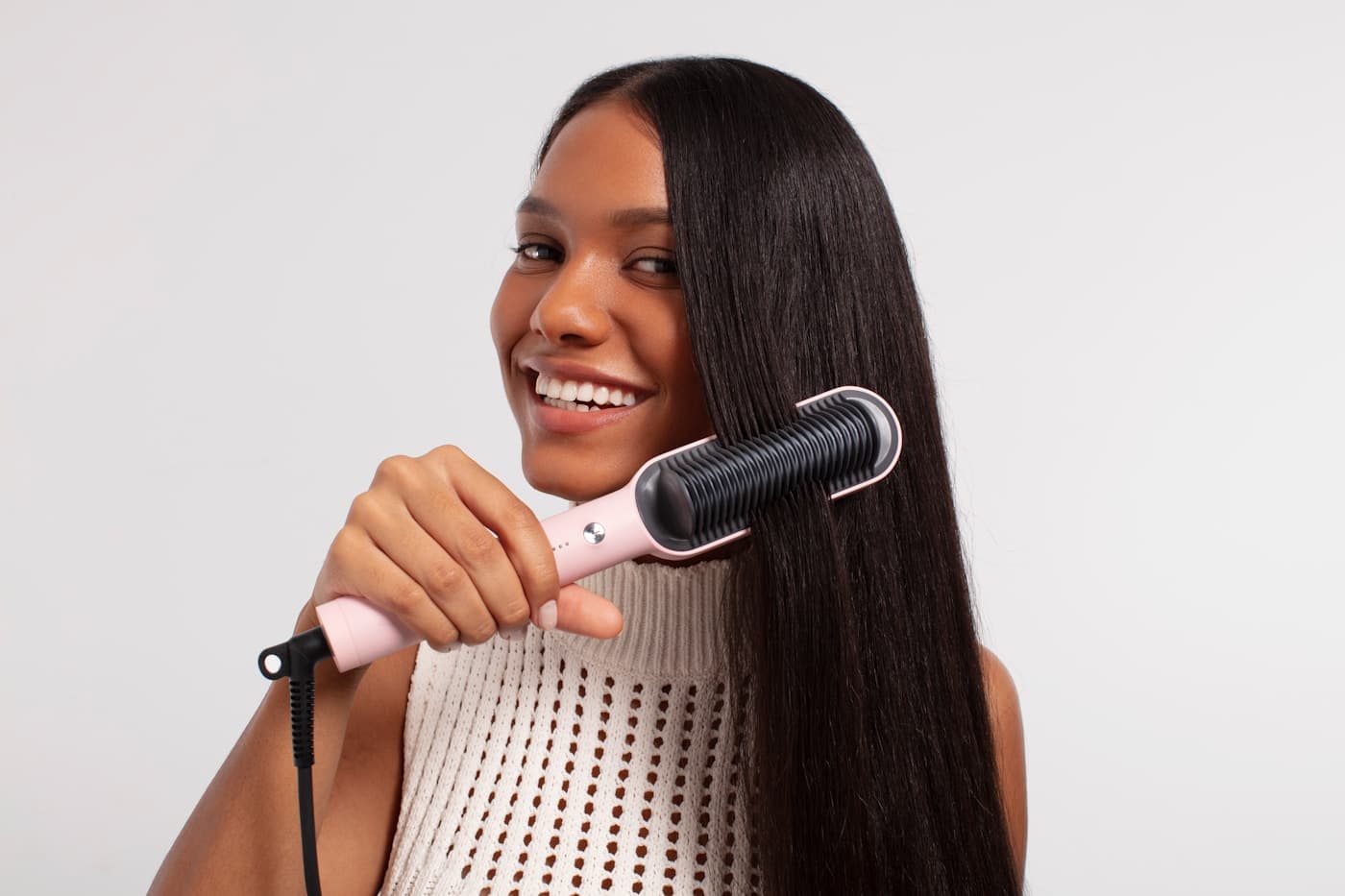 Blow-dry finish on long dark hair