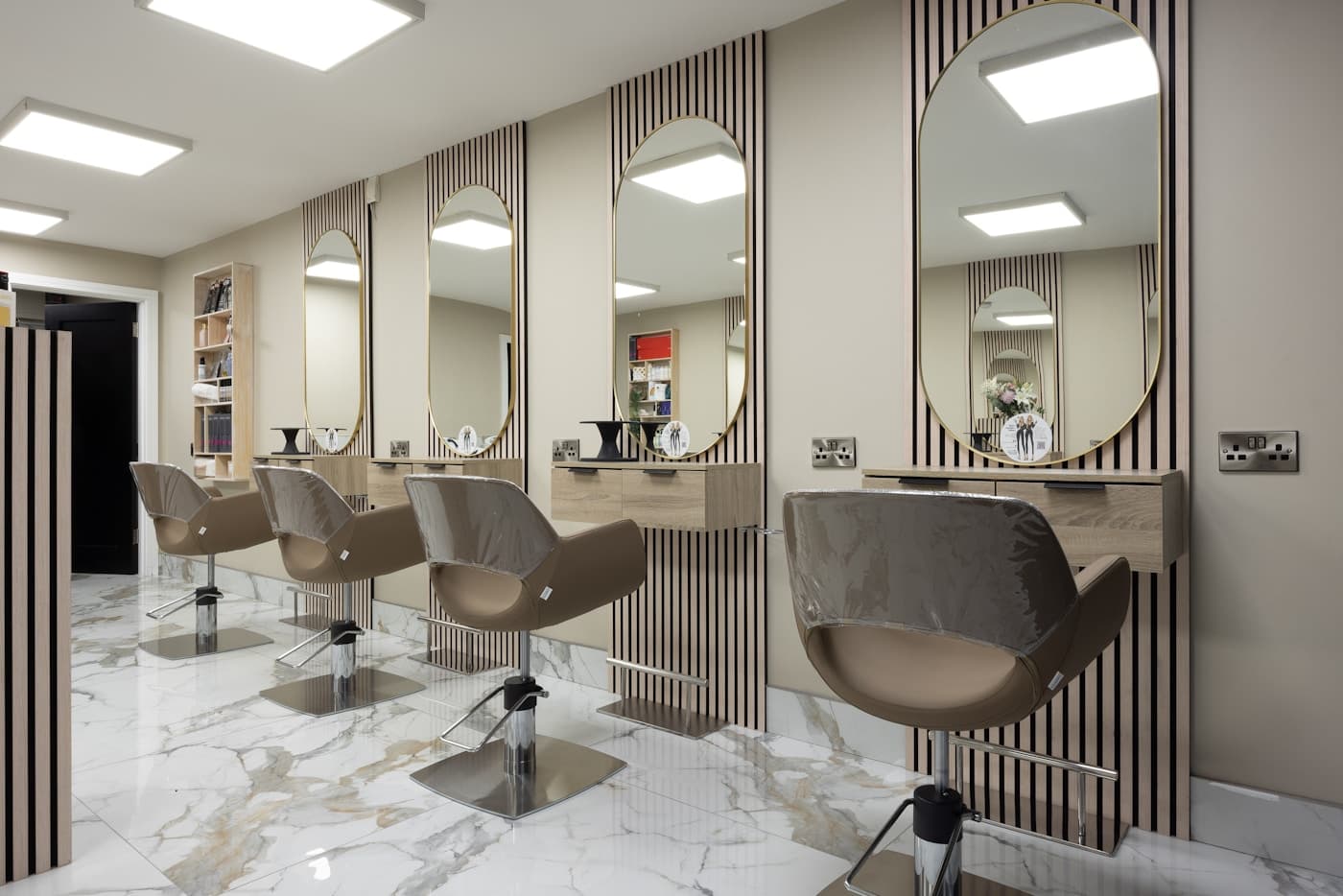 Marble-and-brass studio floor with oval mirrors